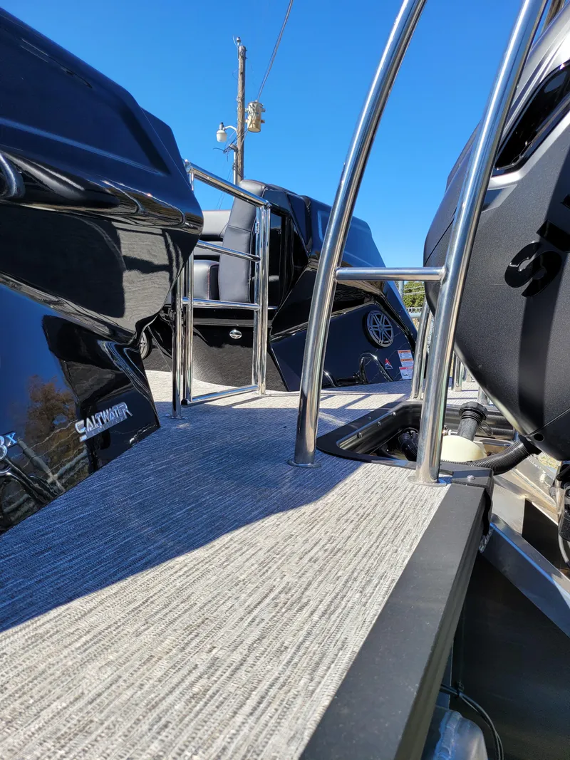 Slide: The Image of 2025 Quest M-22RLS LIMITED boat deck with sleek design and stainless steel railings. - 10