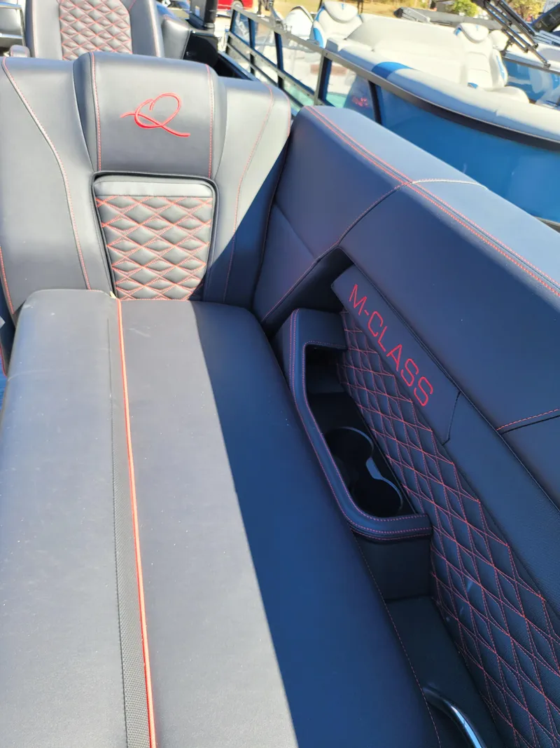 Slide: The Image of Luxurious seating in 2025 Quest M-22RLS LIMITED boat with quilted design and "M-CLASS" embroidery. - 13