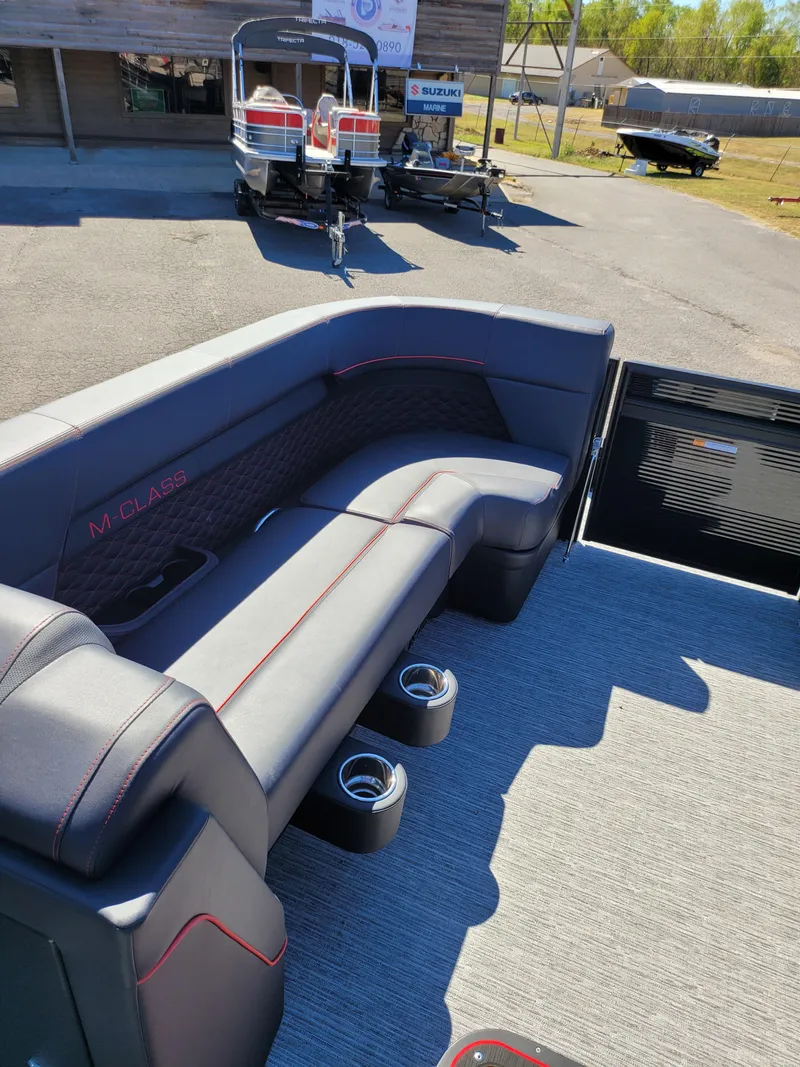 Slide: The Image of 2025 Quest M-22RLS LIMITED boat interior with gray seating and cup holders. - 15