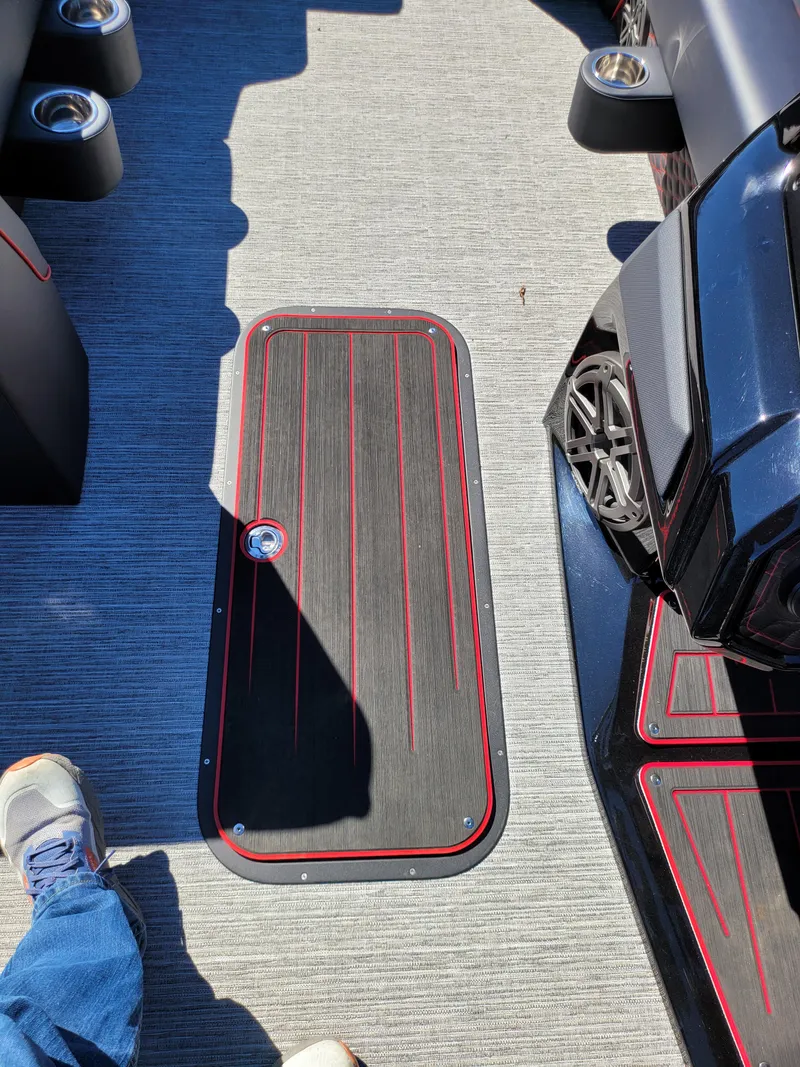 Slide: The Image of 2025 Quest M-22RLS LIMITED interior with sleek flooring and cup holders. - 19