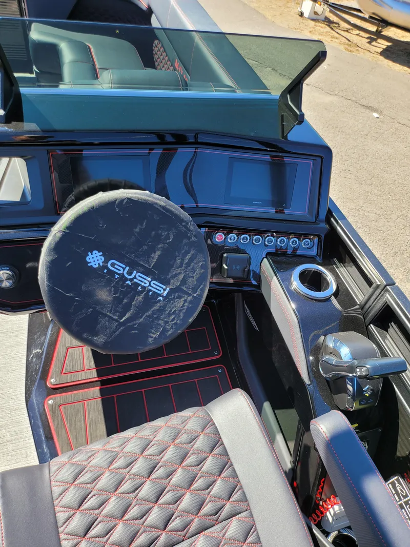 Slide: The Image of 2025 Quest M-22RLS LIMITED boat interior with steering wheel and dashboard controls. - 21