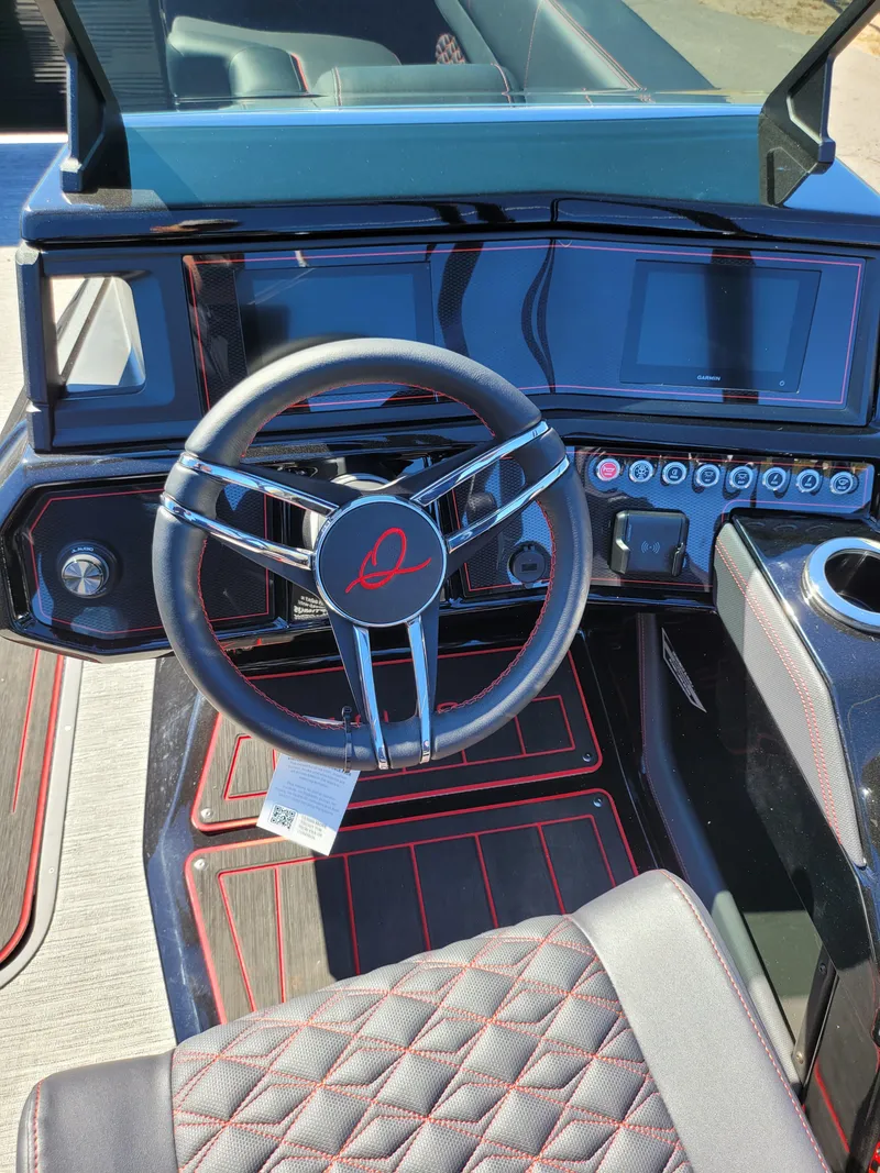 Slide: The Image of 2025 Quest M-22RLS LIMITED dashboard with steering wheel and modern controls. - 22