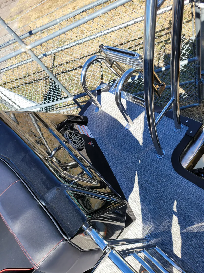 Slide: The Image of 2025 Quest M-22RLS LIMITED boat deck with chrome railings and seating. - 28