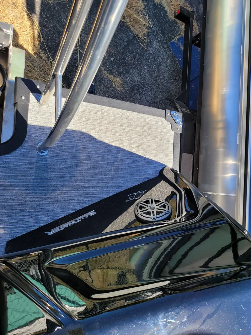 Slide: The Image of 2025 Quest M-22RLS LIMITED boat deck with stainless steel railings and sleek design. - 29