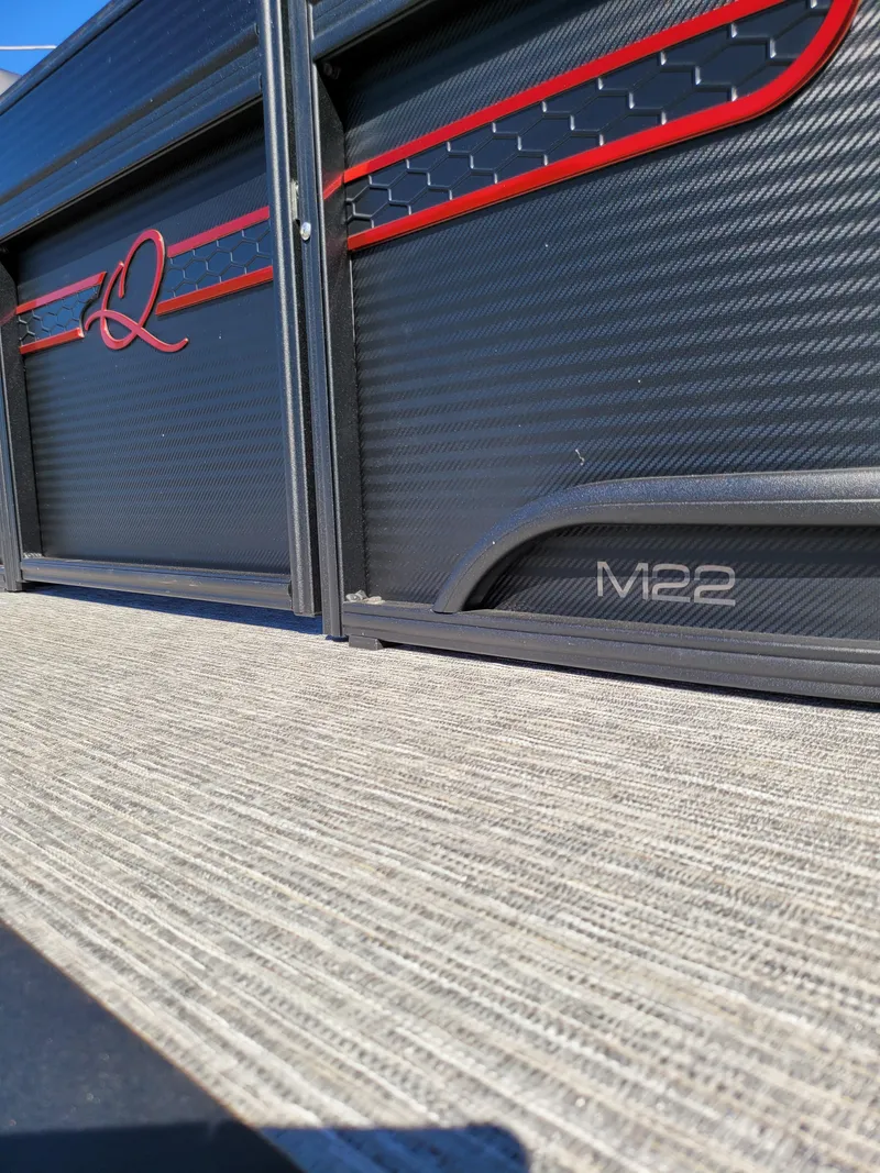 Slide: The Image of 2025 Quest M-22RLS LIMITED exterior with sleek black and red design. - 3