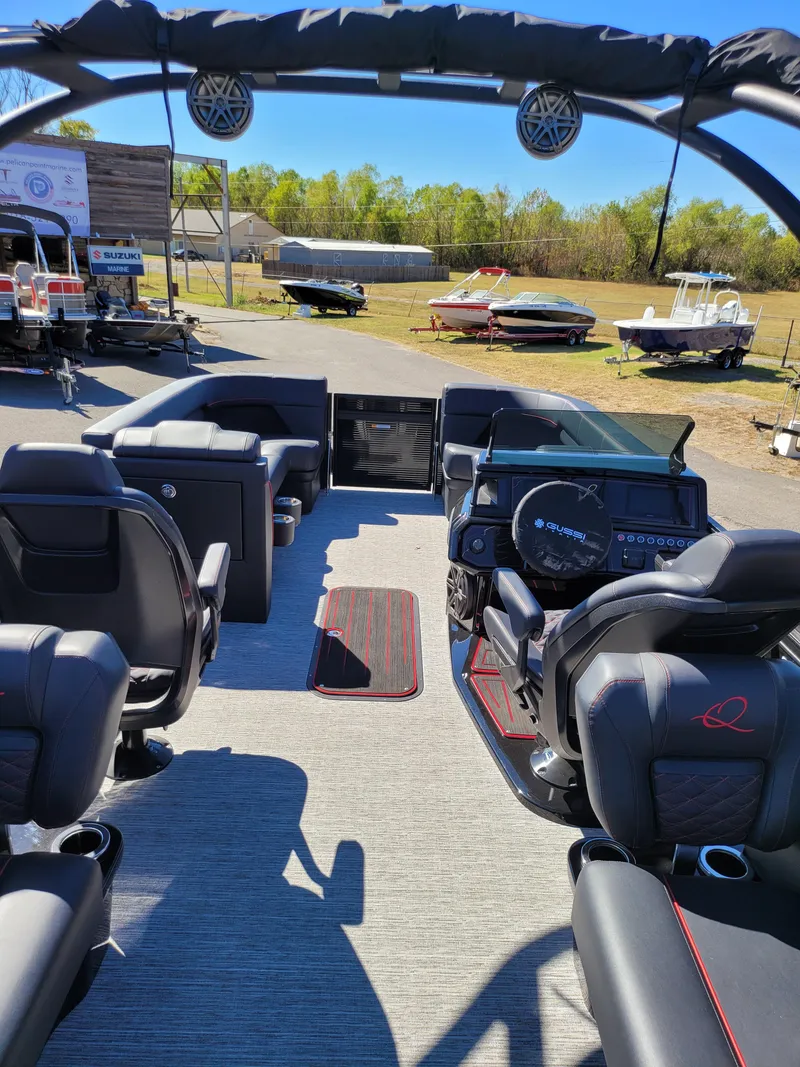 Slide: The Image of Interior of 2025 Quest M-22RLS LIMITED boat with modern seating and dashboard. - 30