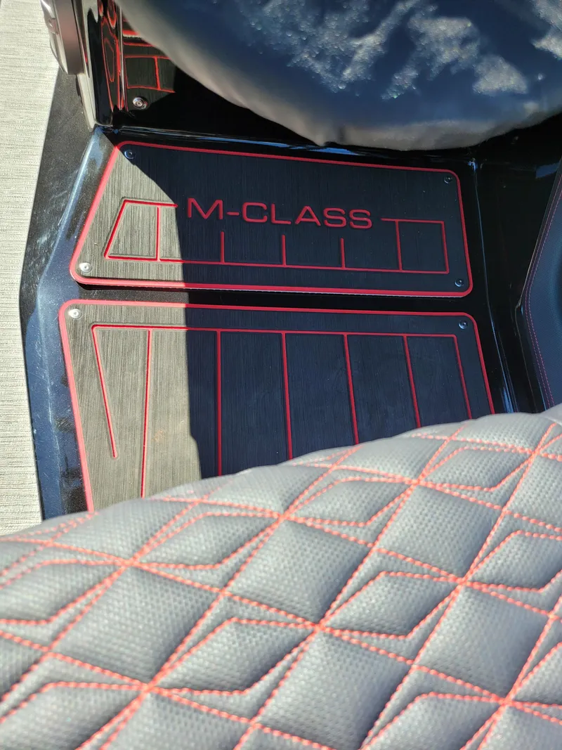 Slide: The Image of 2025 Quest M-22RLS LIMITED interior with M-Class branding and quilted seat design. - 31