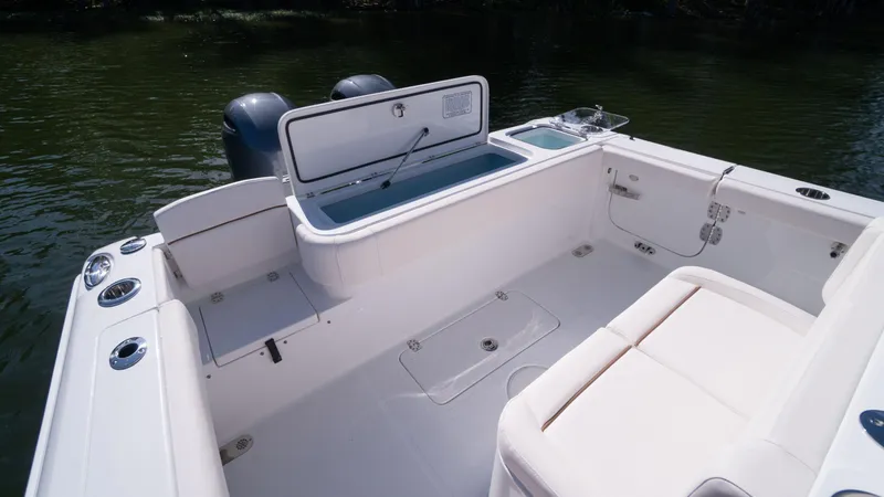 Slide: The Image of 2025 Sea Hunt Gamefish 27 Coffin Box boat interior with open storage compartment. - 12