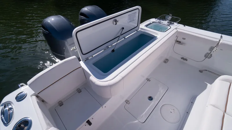 Slide: The Image of 2025 Sea Hunt Gamefish 27 Coffin Box boat interior with open storage compartment. - 13