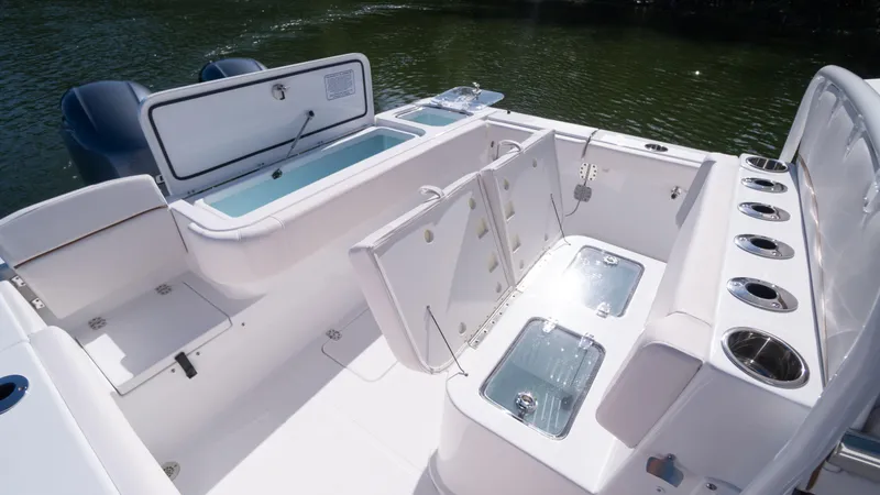 Slide: The Image of 2025 Sea Hunt Gamefish 27 Coffin Box boat interior with storage and seating. - 14
