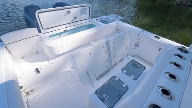 Slide: The Image of 2025 Sea Hunt Gamefish 27 Coffin Box boat interior with storage compartments. - 15