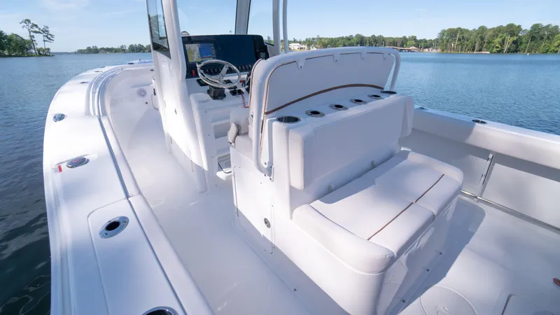 Slide: The Image of 2025 Sea Hunt Gamefish 27 Coffin Box boat interior on a serene lake. - 16
