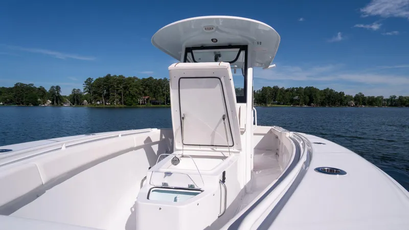 Slide: The Image of 2025 Sea Hunt Gamefish 27 Coffin Box boat on a serene lake. - 20