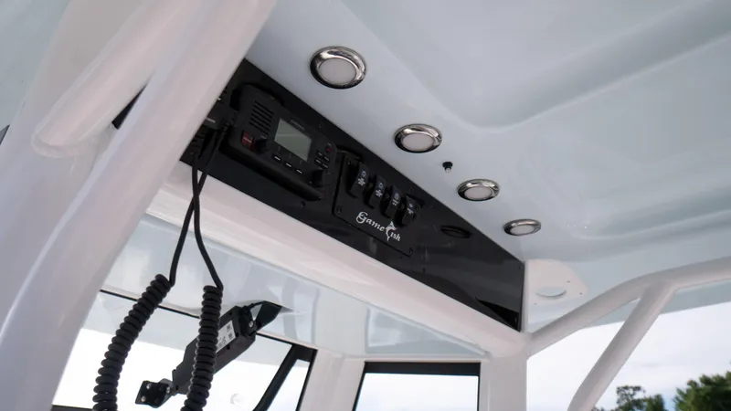 Slide: The Image of 2025 Sea Hunt Gamefish 27 Coffin Box console with electronics and controls. - 30