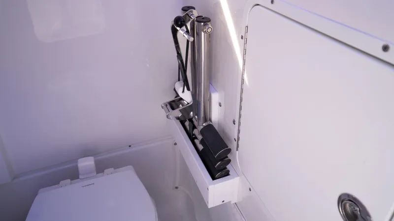 Slide: The Image of Interior of 2025 Sea Hunt Gamefish 27 Coffin Box, featuring storage compartment and hydraulic system. - 32