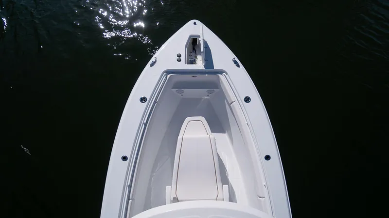 Slide: The Image of 2025 Sea Hunt Gamefish 27 Coffin Box boat, aerial view, sleek design on water. - 4