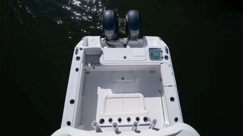 Slide: The Image of 2025 Sea Hunt Gamefish 27 Coffin Box boat, rear view with dual engines. - 5