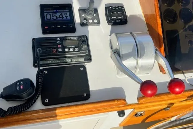 Slide: The Image of Control panel of 1989 Duffy Wilbur 42 Flybridge Cruiser with throttle and navigation instruments. - 15