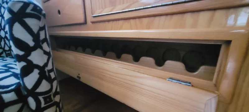 Slide: The Image of Wooden interior detail of 1989 Duffy Wilbur 42 Flybridge Cruiser with built-in storage compartment. - 19