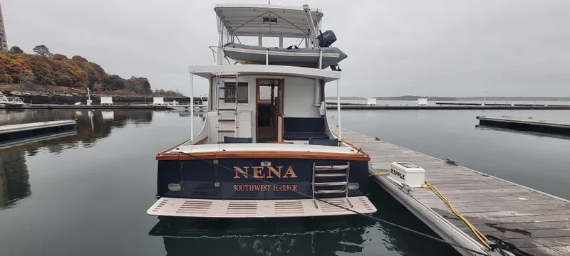 Slide: The Image of 1989 Duffy Wilbur 42 Flybridge Cruiser docked at marina, rear view. - 3