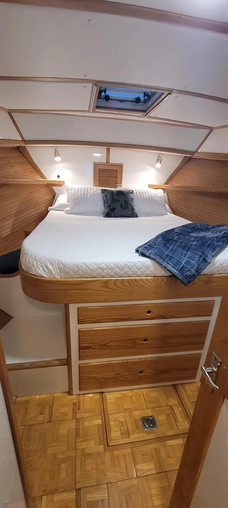 Slide: The Image of Cozy cabin interior of 1989 Duffy Wilbur 42 Flybridge Cruiser with wood accents and skylight. - 37