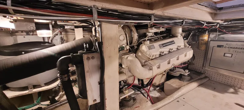 Slide: The Image of Engine room of 1989 Duffy Wilbur 42 Flybridge Cruiser with visible machinery and wiring. - 41