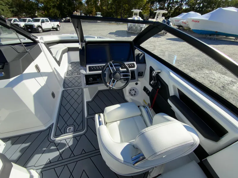 Slide: The Image of 2025 Cobalt R6 Outboard boat interior with modern dashboard and steering wheel. - 11