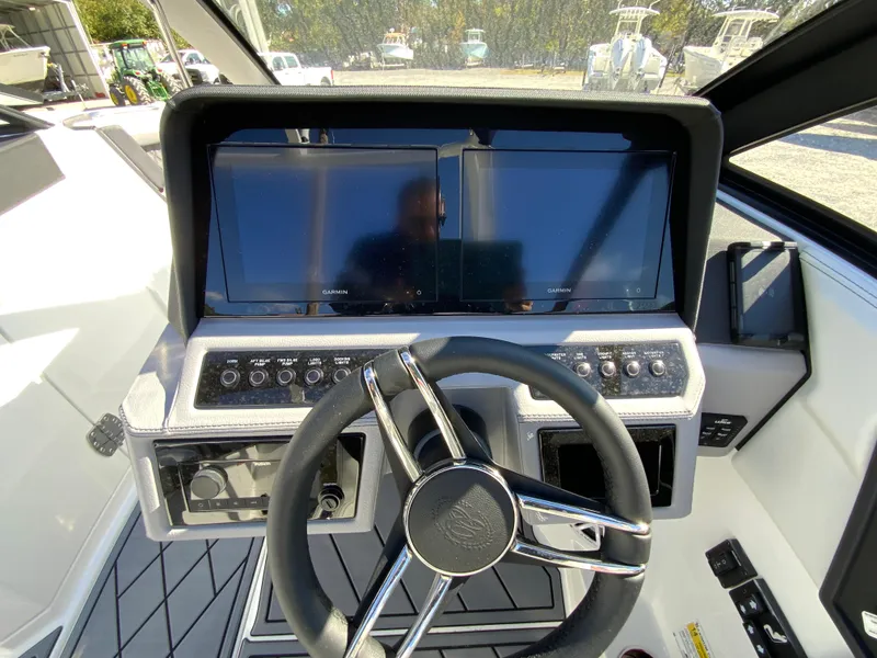 Slide: The Image of 2025 Cobalt R6 Outboard dashboard with dual screens and modern steering wheel. - 12