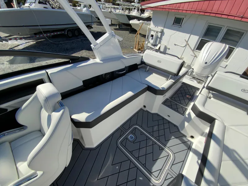 Slide: The Image of 2025 Cobalt R6 Outboard boat interior with white seating and modern design. - 17