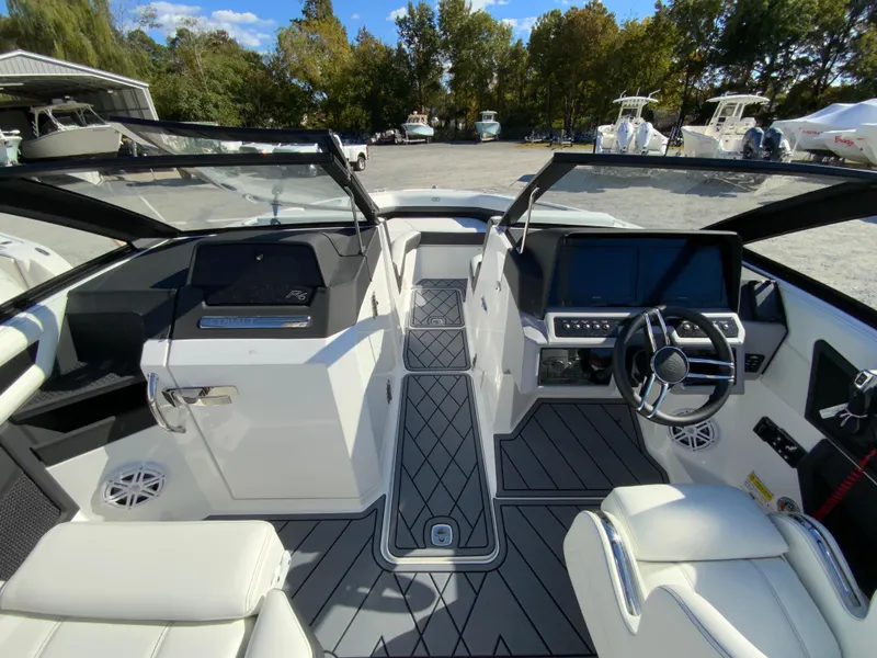 Slide: The Image of Interior view of 2025 Cobalt R6 Outboard boat with modern dashboard and seating. - 18