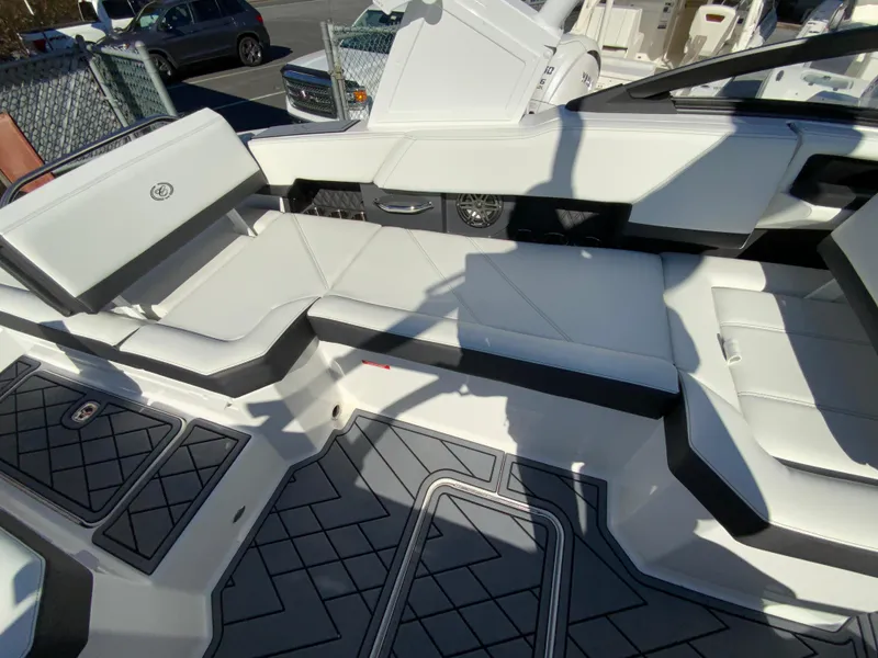 Slide: The Image of 2025 Cobalt R6 Outboard boat interior with white seating and modern design. - 23