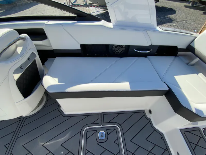 Slide: The Image of 2025 Cobalt R6 Outboard interior with white seating and modern design. - 25