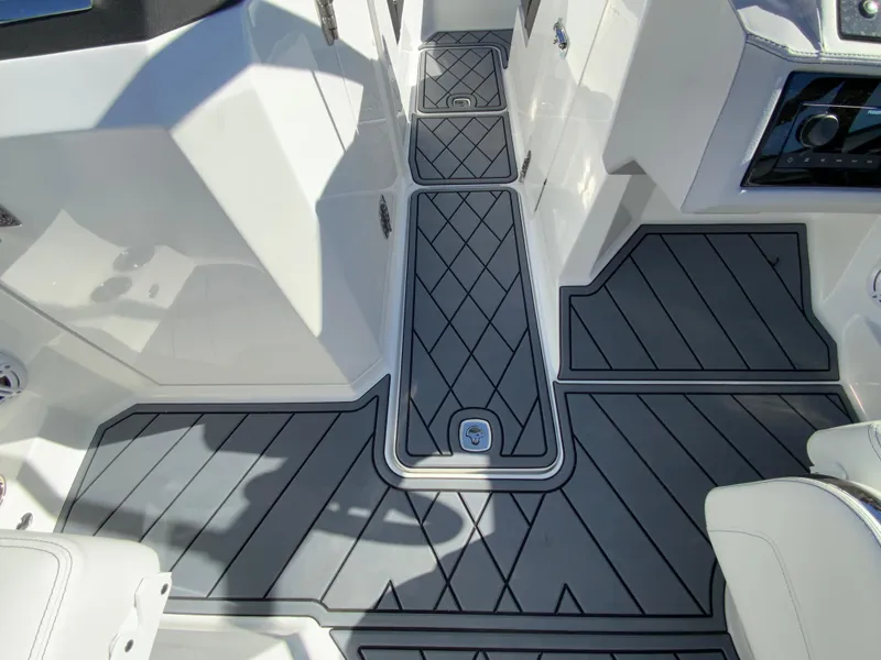 Slide: The Image of 2025 Cobalt R6 Outboard boat interior with sleek, modern flooring design. - 28
