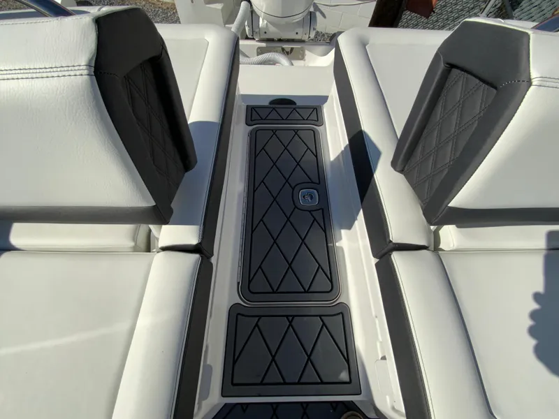 Slide: The Image of 2025 Cobalt R6 Outboard boat interior with diamond-stitched seating and non-slip flooring. - 31