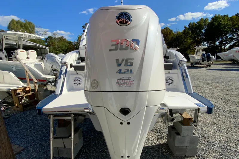 Slide: The Image of 2025 Cobalt R6 Outboard boat with powerful V6 4.2L engine, parked outdoors. - 32