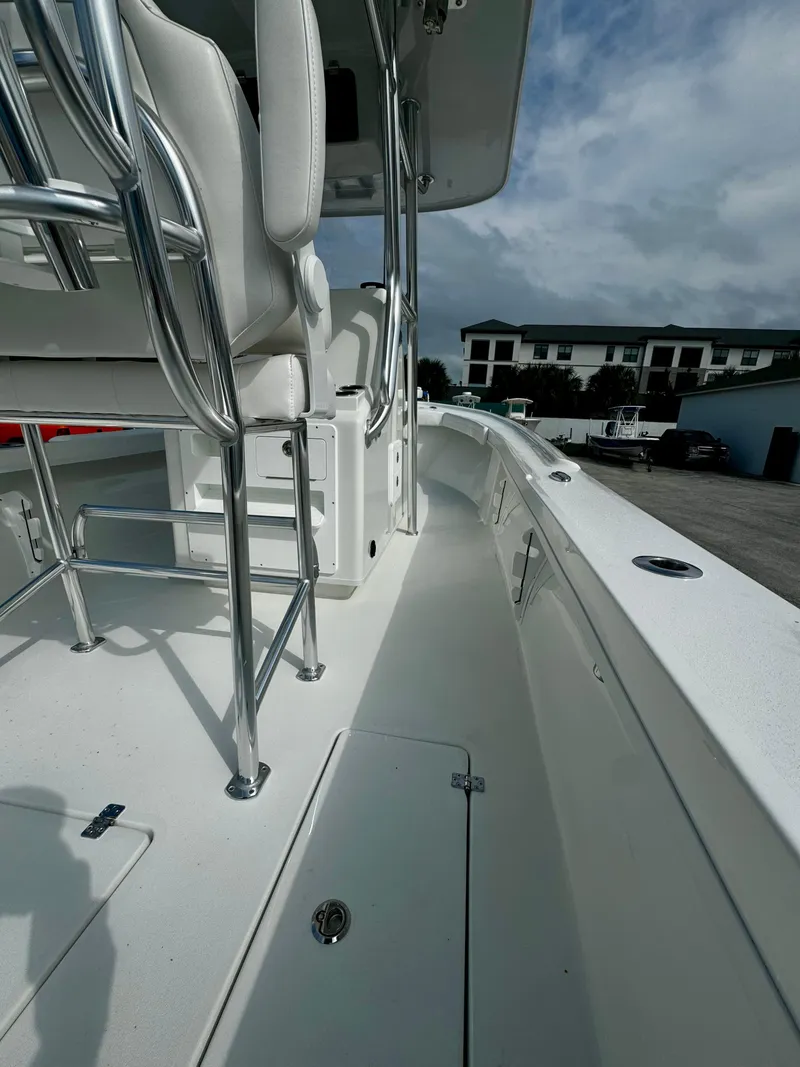 Slide: The Image of 2025 Pair Customs 27 Center Console boat, sleek white deck, modern design. - 12