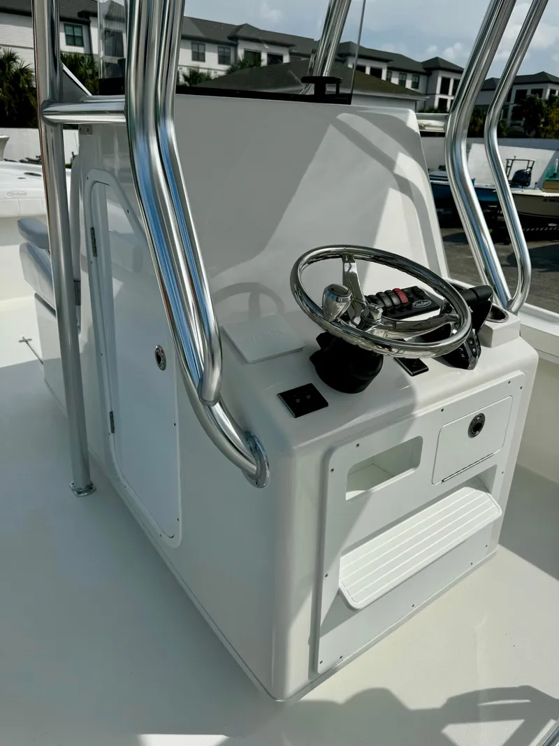 Slide: The Image of 2025 Pair Customs 27 Center Console boat with sleek steering console and modern controls. - 15