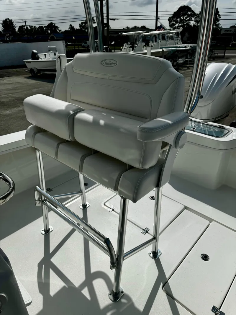 Slide: The Image of 2025 Pair Customs 27 Center Console boat seat with chrome accents. - 17