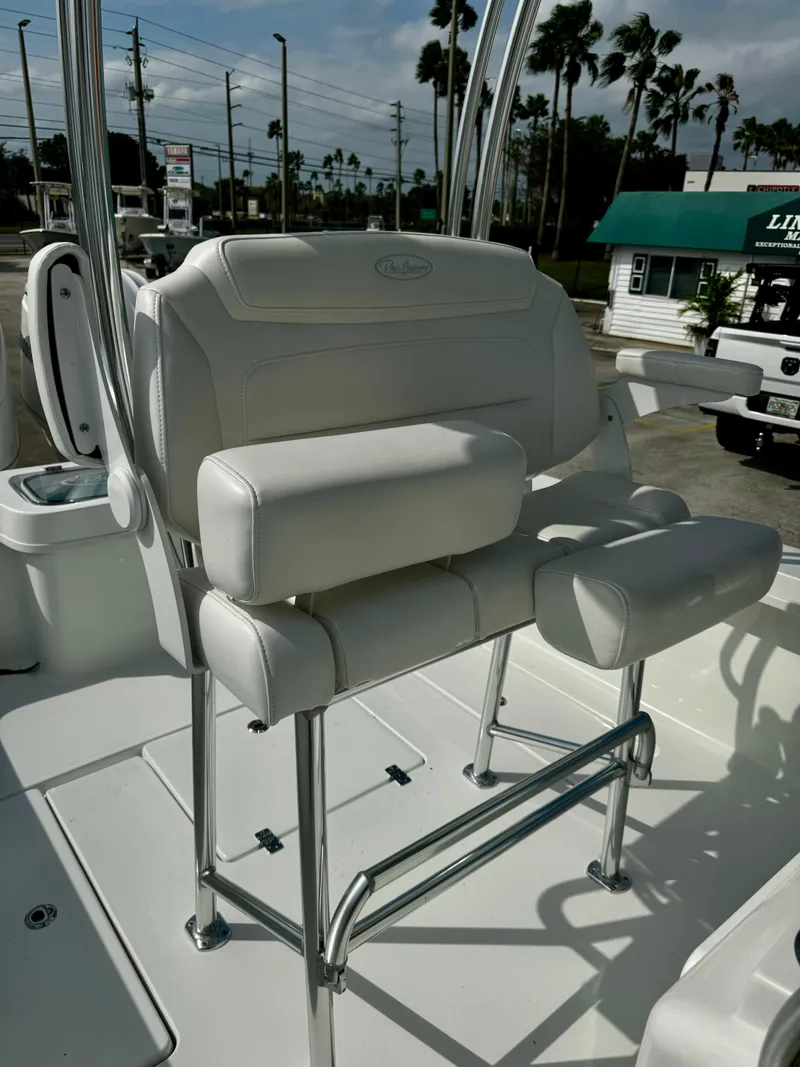 Slide: The Image of 2025 Pair Customs 27 Center Console boat seat with white upholstery and chrome accents. - 18