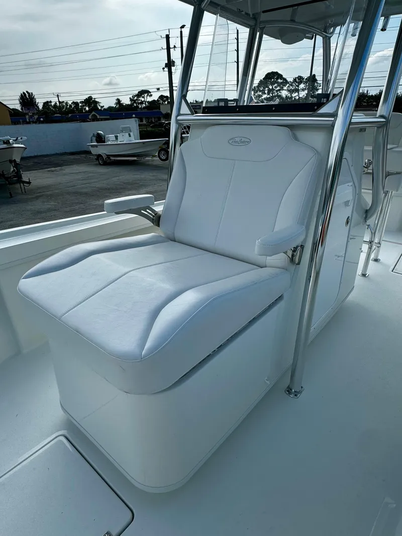 Slide: The Image of 2025 Pair Customs 27 Center Console boat with sleek white seating and modern design. - 21
