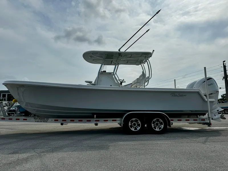 Slide: The Image of 2025 Pair Customs 27 Center Console boat on trailer, side view. - 6