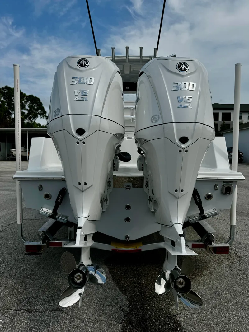 Slide: The Image of 2025 Pair Customs 27 Center Console with twin 300 V6 outboard engines. - 8