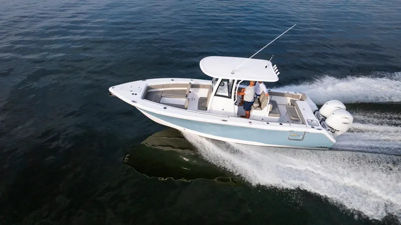 Slide: The Image of 2025 Sea Hunt Gamefish 27 boat cruising on open water. - 11
