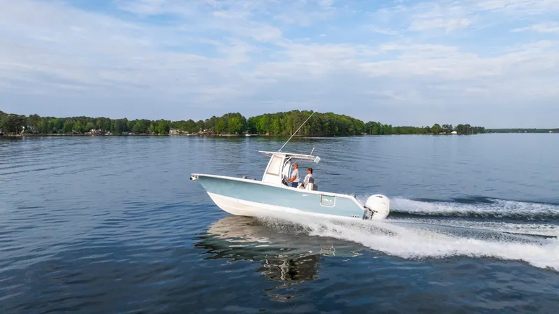 Slide: The Image of 2025 Sea Hunt Gamefish 27 cruising on a serene lake. - 12