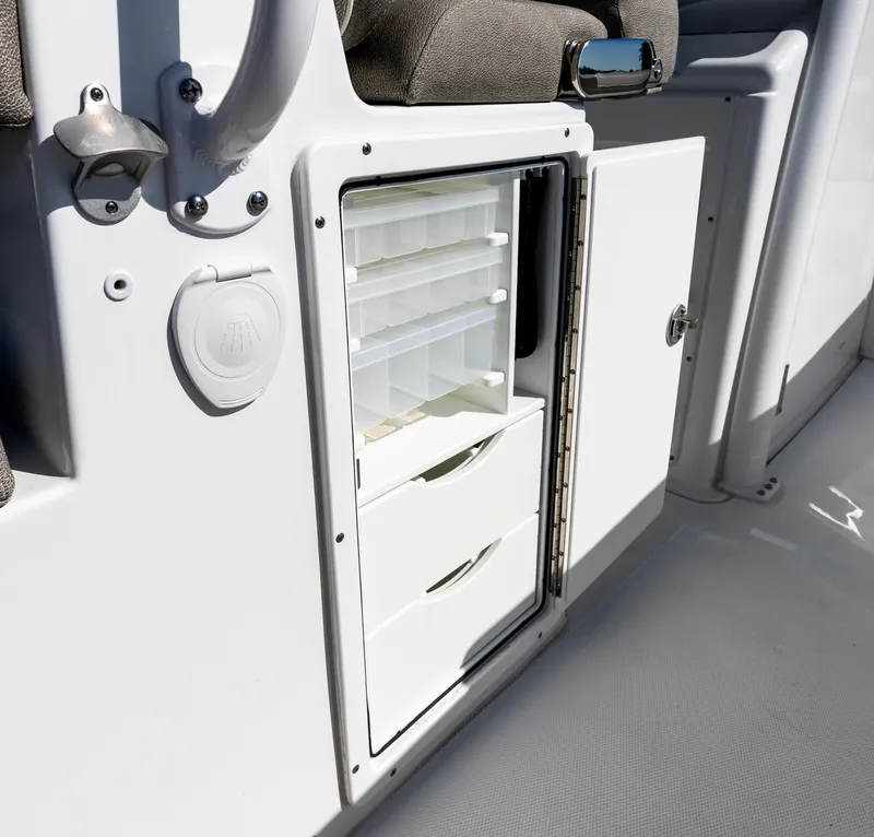 Slide: The Image of 2025 Sea Hunt Gamefish 27 storage compartment with drawers and tackle boxes. - 16