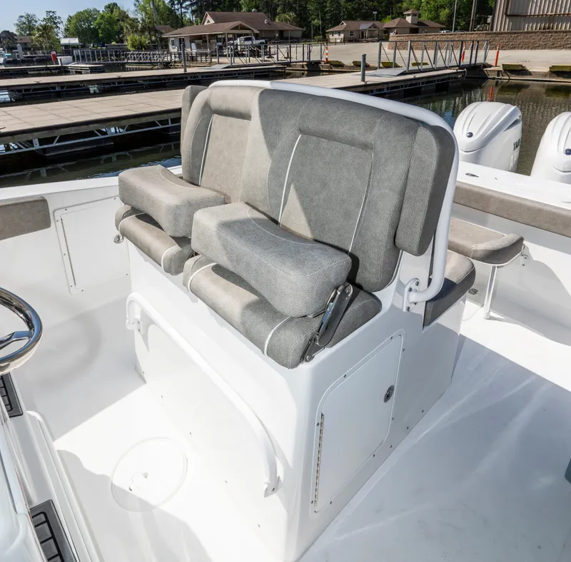 Slide: The Image of 2025 Sea Hunt Gamefish 27 boat with forward seating, docked at marina. - 18