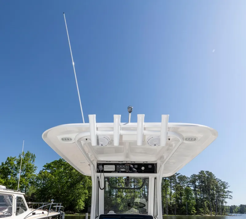 Slide: The Image of 2025 Sea Hunt Gamefish 27 boat with forward seating, clear sky background. - 19