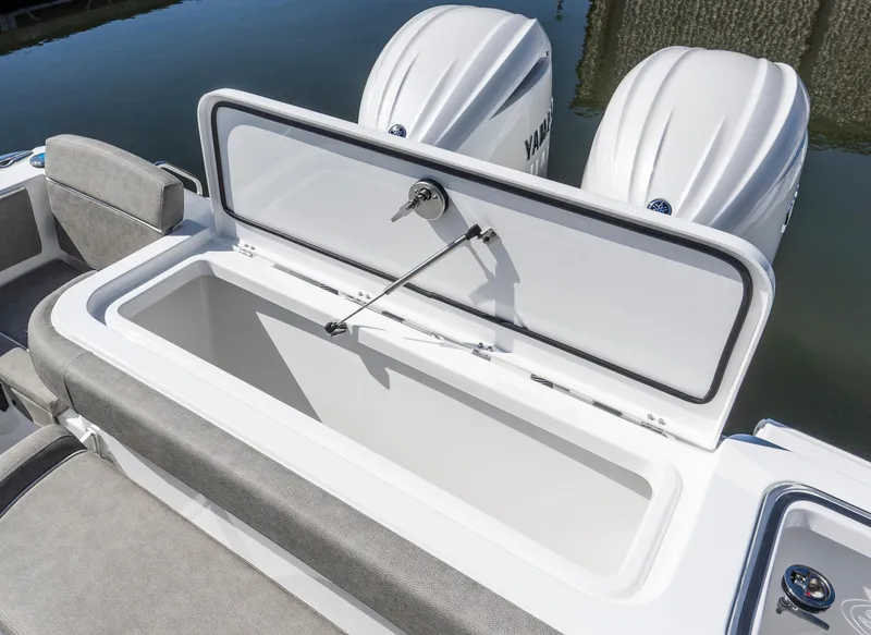 Slide: The Image of 2025 Sea Hunt Gamefish 27 boat with open storage compartment and twin engines. - 20
