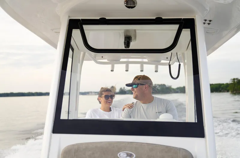 Slide: The Image of Couple enjoying a ride on a 2025 Sea Hunt Gamefish 27 boat. - 22