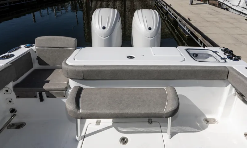 Slide: The Image of 2025 Sea Hunt Gamefish 27 boat interior with forward seating and dual engines. - 5